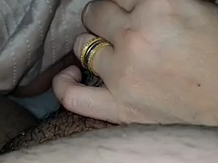 Stepmother under the blanket jerks off stepsons dick