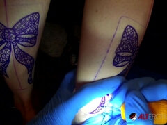 Busty inked blonde gets a new tattoo and two big dicks - Sascha ink