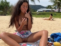 Katty West gets naughty on a crowded beach - Bare pussy and fruit feast!