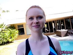 Clothed redhead takes cum