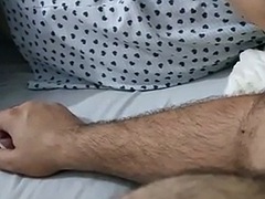 Shameless stepson sits on the bed naked near his stepmom with his cock out